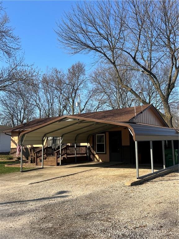 view of car parking featuring a carport and driveway