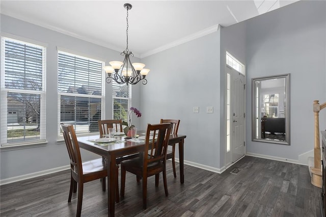 dining space with dark wood-type flooring, plenty of natural light, and baseboards