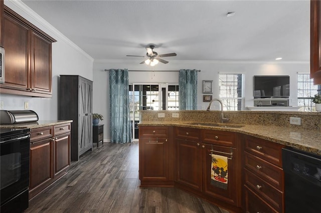 kitchen featuring dark wood-type flooring, black appliances, ornamental molding, a sink, and a healthy amount of sunlight