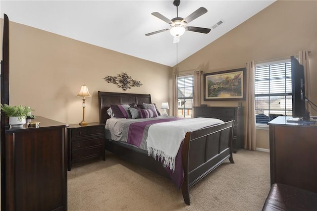 bedroom featuring visible vents, light colored carpet, a ceiling fan, and vaulted ceiling