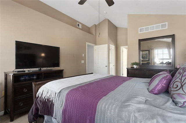 bedroom featuring high vaulted ceiling, visible vents, light colored carpet, and a ceiling fan