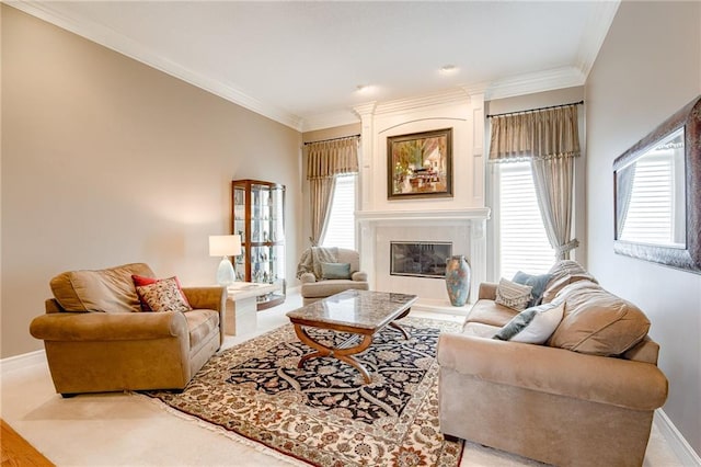 living area featuring a fireplace, baseboards, and ornamental molding