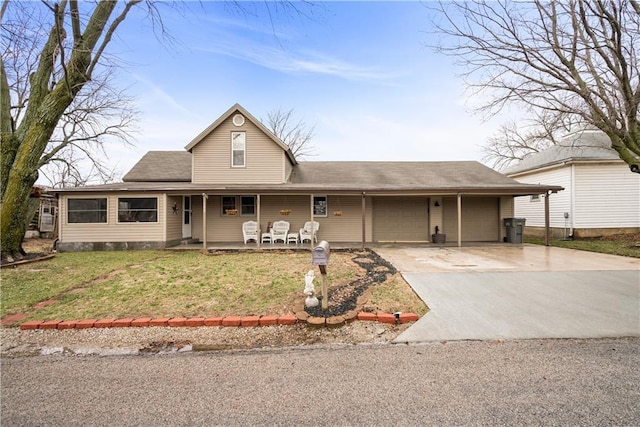 view of front of property with a garage, driveway, a porch, and a front yard