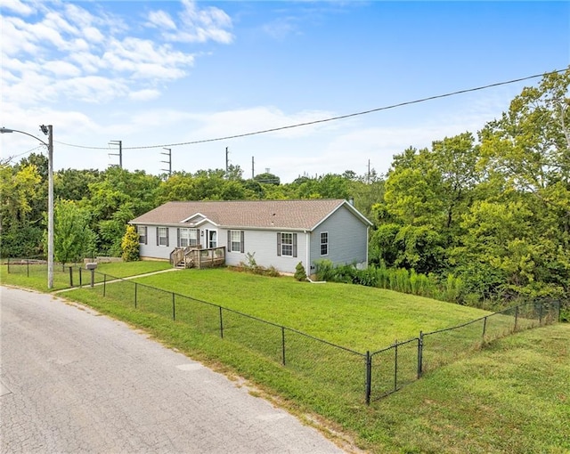 single story home with fence private yard and a front yard