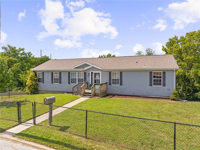 single story home featuring a fenced backyard, a front lawn, and a gate