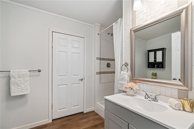1310 Lawrence Ave, Kansas City, KS 66103 - bathroom with baseboards, ornamental molding, a shower with curtain, wood finished floors, and vanity