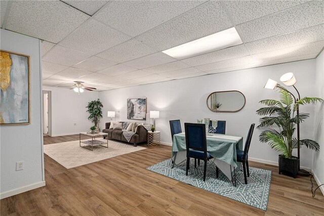 1310 Lawrence Ave, Kansas City, KS 66103 - dining area featuring baseboards and wood finished floors