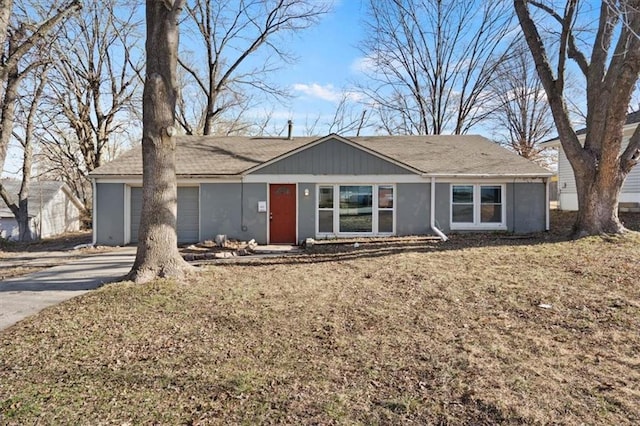 ranch-style house with concrete driveway and an attached garage