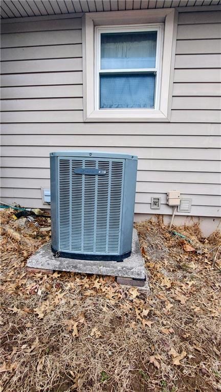 exterior details featuring crawl space and cooling unit