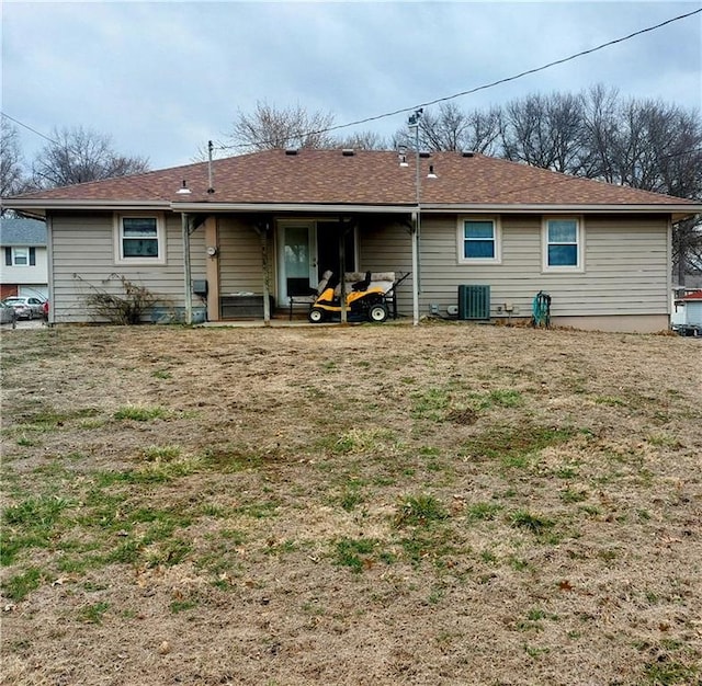 rear view of house featuring central AC unit