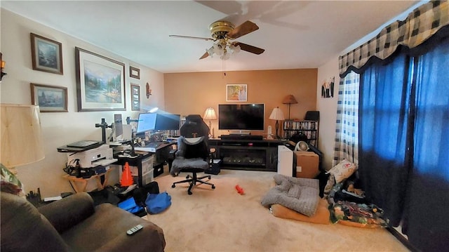 home office featuring carpet and a ceiling fan