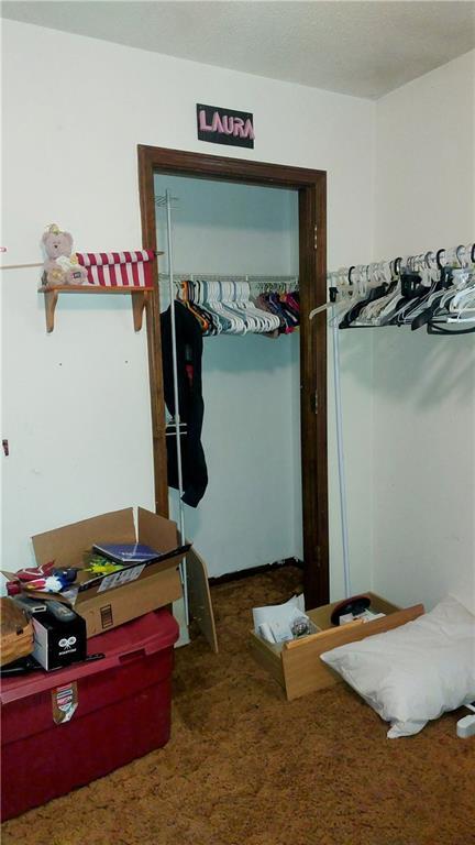 bedroom with carpet floors and a closet