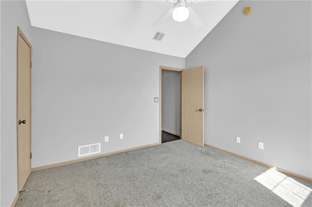 unfurnished bedroom featuring lofted ceiling, baseboards, visible vents, and carpet floors