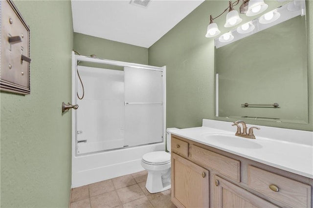 full bath with visible vents, toilet, tile patterned flooring, bath / shower combo with glass door, and vanity