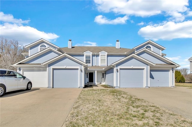 view of front of property featuring a garage and concrete driveway