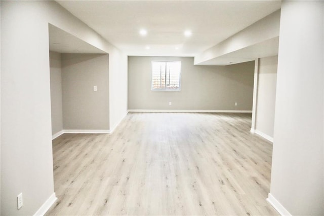 below grade area featuring recessed lighting, baseboards, and wood finished floors