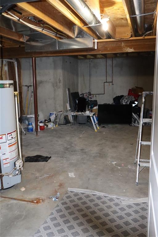 unfinished basement with water heater