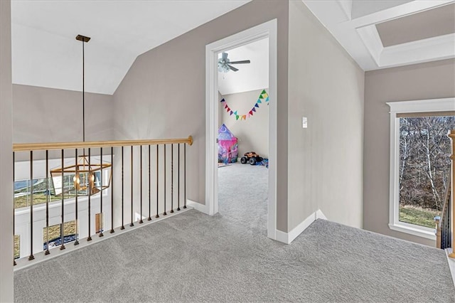 hall featuring baseboards, carpet floors, coffered ceiling, and lofted ceiling