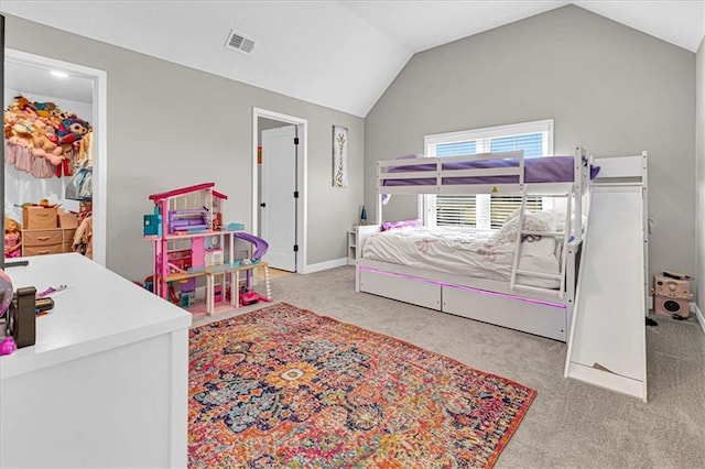 bedroom featuring vaulted ceiling, carpet flooring, baseboards, and visible vents