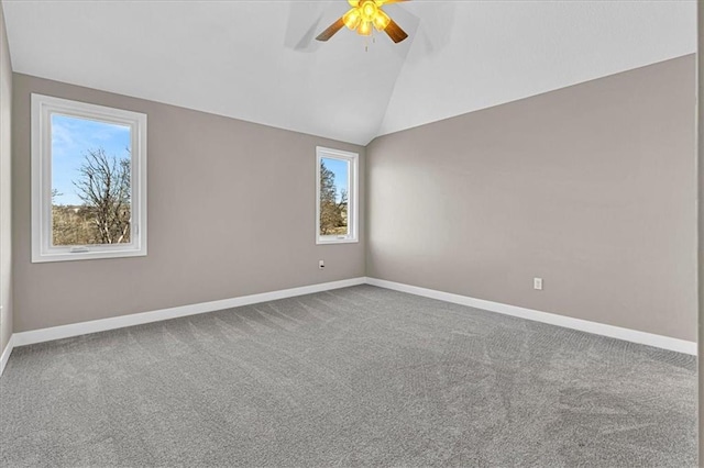 unfurnished room with baseboards, carpet, lofted ceiling, and ceiling fan