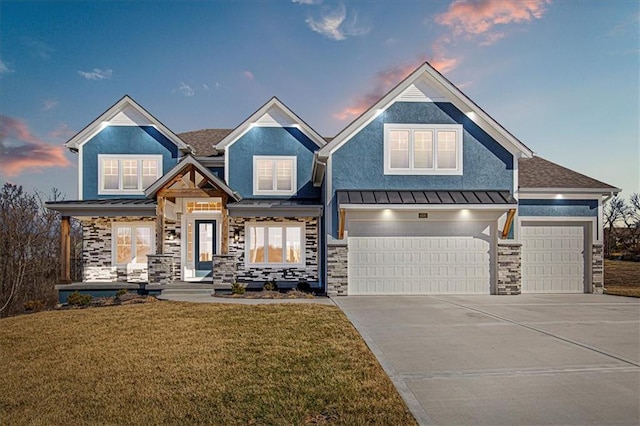 craftsman inspired home with a standing seam roof, a front lawn, and metal roof