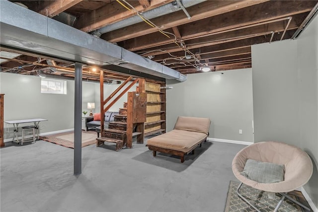 basement with stairway and baseboards