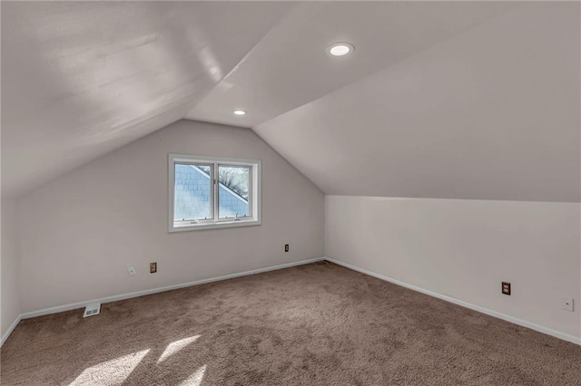 additional living space with vaulted ceiling, recessed lighting, carpet, and baseboards