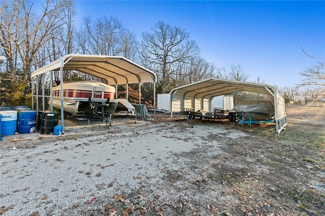 view of parking / parking lot featuring a detached carport