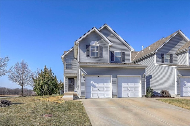 traditional-style home featuring driveway, a front yard, and a garage