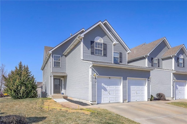 traditional-style home with central air condition unit and concrete driveway