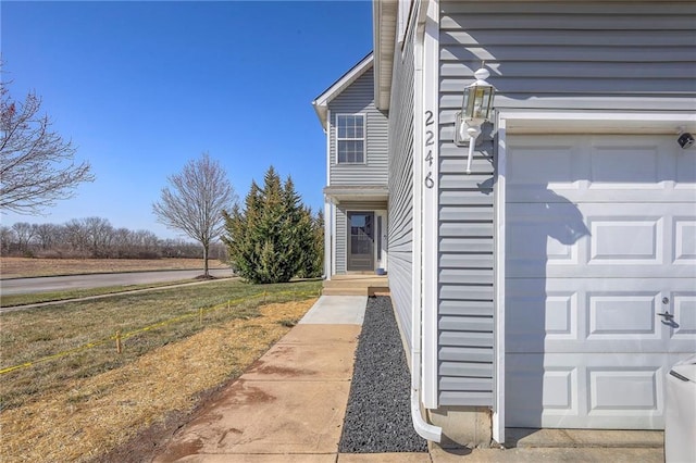 view of side of home featuring a garage