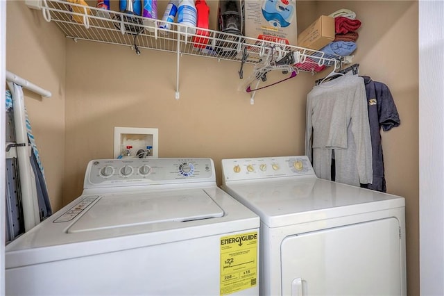 clothes washing area featuring laundry area and washing machine and dryer