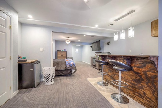 bar featuring baseboards, carpet floors, recessed lighting, hanging light fixtures, and bar area