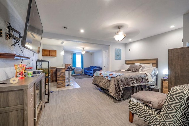 bedroom featuring recessed lighting, visible vents, and light carpet