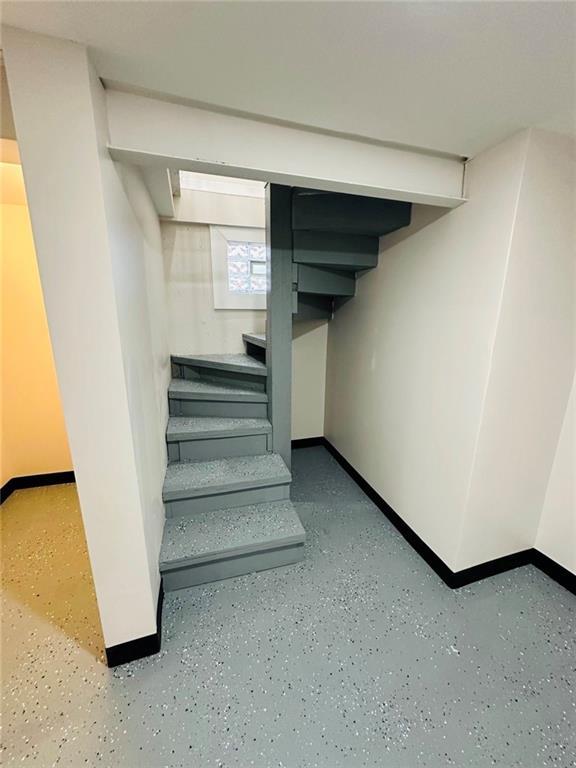 stairway with baseboards