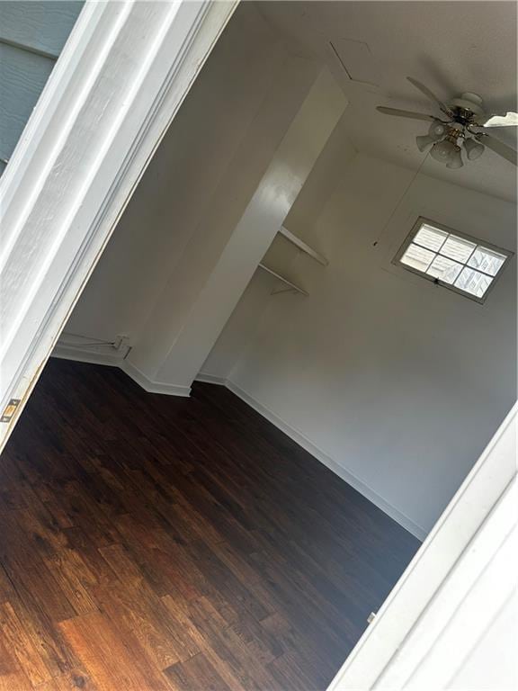 unfurnished room featuring ceiling fan and wood finished floors