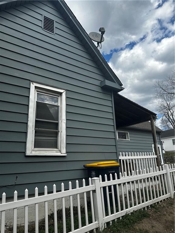 view of side of property with fence