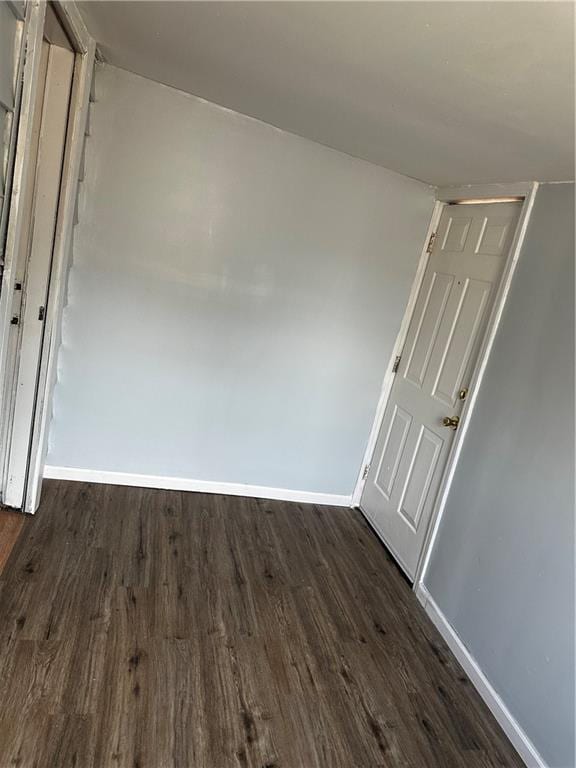 480 Wallace Ave, Kansas City, MO 64125 - unfurnished room featuring dark wood finished floors and baseboards