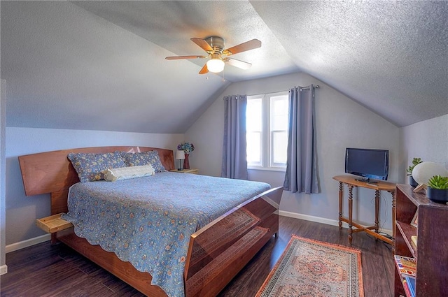 bedroom with ceiling fan, baseboards, wood finished floors, and vaulted ceiling