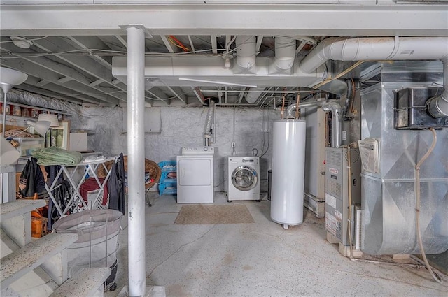 unfinished basement featuring washer and dryer, gas water heater, and heating unit