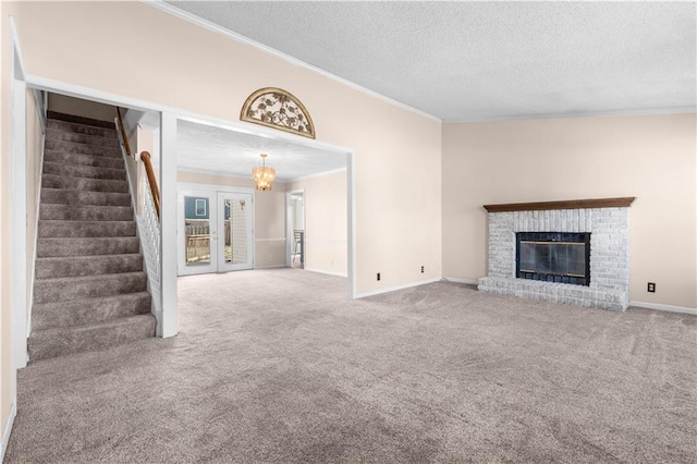 unfurnished living room featuring stairway, a textured ceiling, crown molding, and carpet