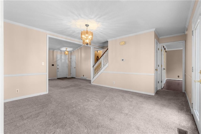 carpeted spare room featuring visible vents, crown molding, baseboards, stairway, and an inviting chandelier