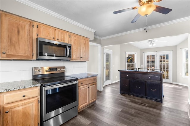 kitchen with dark wood-type flooring, baseboards, light stone countertops, ornamental molding, and stainless steel appliances