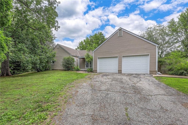 5200 NW Valley View Rd, Blue Springs, MO 64015 - view of front of property with driveway, a garage, and a front yard