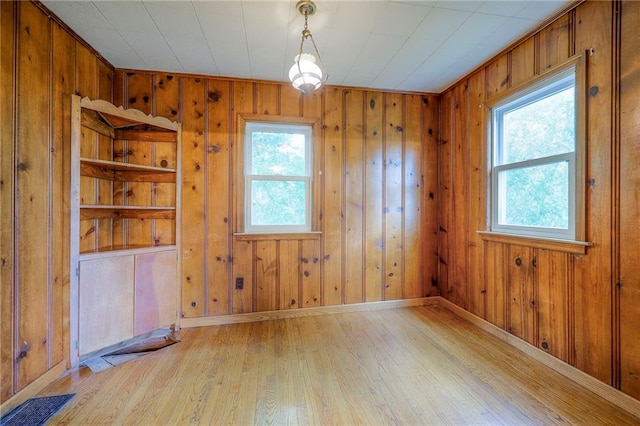 5200 NW Valley View Rd, Blue Springs, MO 64015 - unfurnished room featuring light wood finished floors, wooden walls, and baseboards