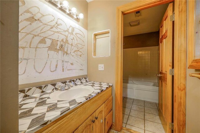 5200 NW Valley View Rd, Blue Springs, MO 64015 - bathroom featuring vanity, a tub to relax in, and tile patterned floors