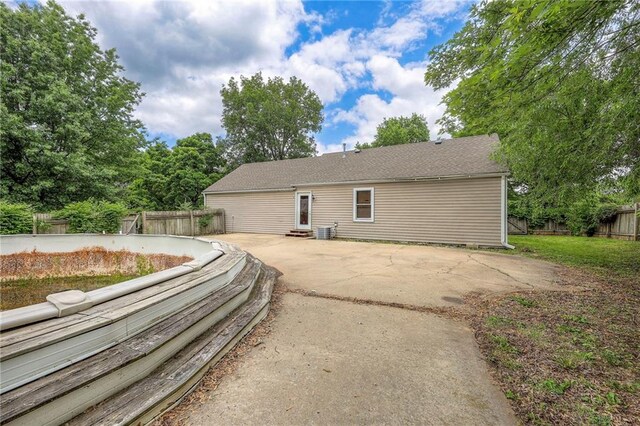 5200 NW Valley View Rd, Blue Springs, MO 64015 - view of home's exterior with a patio, entry steps, and central AC unit