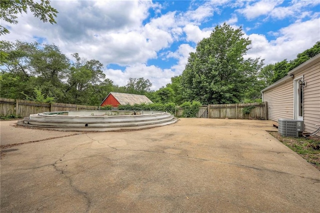 5200 NW Valley View Rd, Blue Springs, MO 64015 - view of patio / terrace featuring central AC unit and view of scattered trees