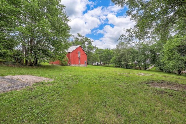 5200 NW Valley View Rd, Blue Springs, MO 64015 - view of green lawn with a barn and an outdoor structure