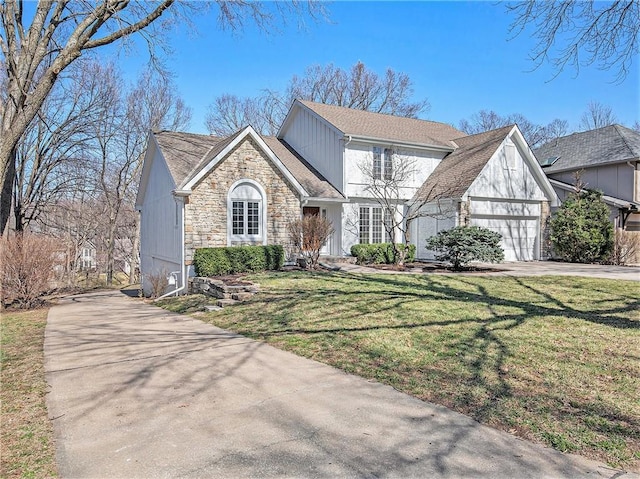 view of front of house featuring a front yard, a garage, stone siding, and driveway